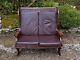 A Nigel Griffiths Oak Two Seater Leather Fireside Chair Settee Winged Armchair