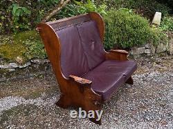 A Nigel Griffiths Oak Two Seater Leather Fireside Chair Settee Winged Armchair