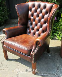 Chesterfield style winged leather Fireside chair maroon brown high button back