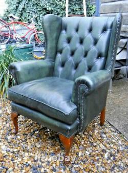 Green Leather Wing Back Chesterfield Armchair/ Fireside Chair- Assist Courier