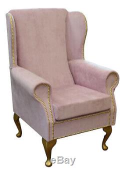 High Wingback Fireside Chair in Blossom Pink Fabric with Gold Studding detail