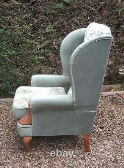 Highback wingback green fabric fireside armchair