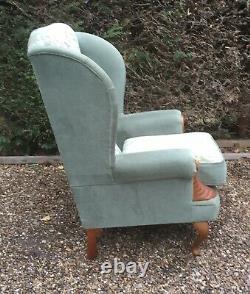 Highback wingback green fabric fireside armchair