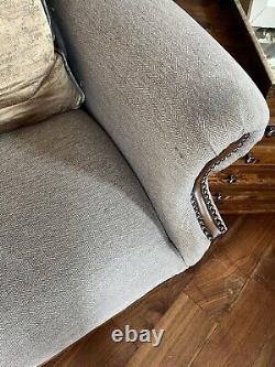 Large high-backed wing fireside chairs x 2, grey herringbone wool with footstool