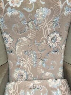 Matching pair of high back wingback fireside floral armchairs