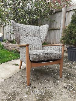 Newly upholstered, Parker Knoll, Wingback fireside armchair with Linwood fabric