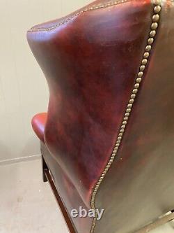 Vintage oxblood leather wingback Fireside chesterfield armchair